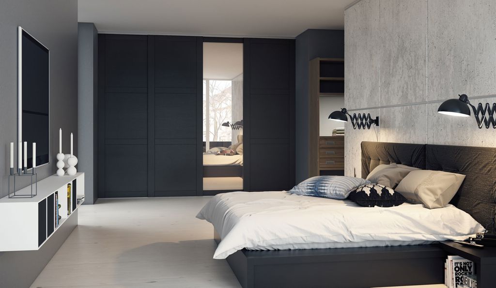 Bedroom with Langlo® Topaz sliding wardrobe wooden doors in stained oak and clear mirror finish